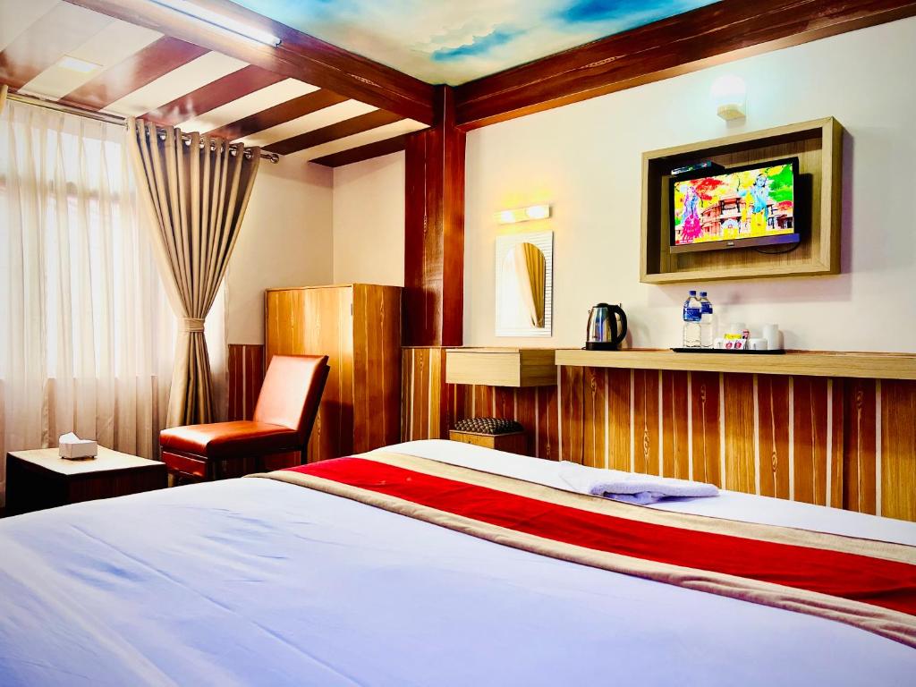 Postel nebo postele na pokoji v ubytování Thamel Seasons Hotel