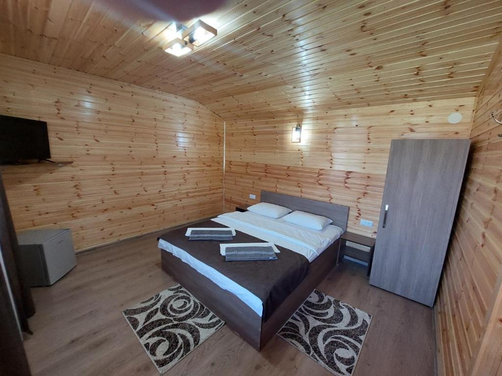 Postel nebo postele na pokoji v ubytování Pensiunea Sonia