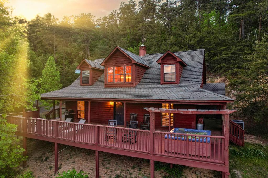 a large wooden house with a large deck at Private Mountain Cabin, hot tub escape in the Smokies, with THE view in Sevierville