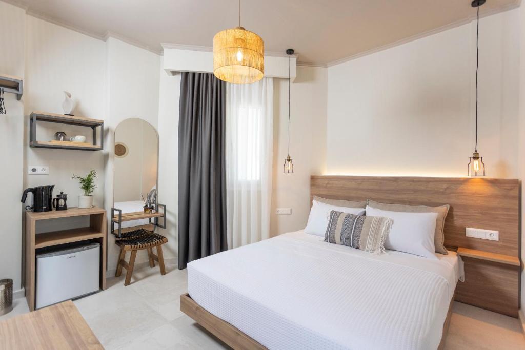Noemie Premium Holiday Apartments tesisinde bir odada yatak veya yataklar