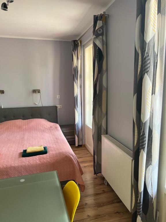 Postel nebo postele na pokoji v ubytování Edgari Guesthouse