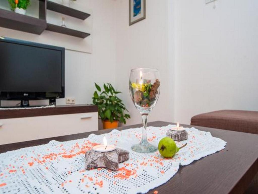 Televízia a/alebo spoločenská miestnosť v ubytovaní Apartment Spalato