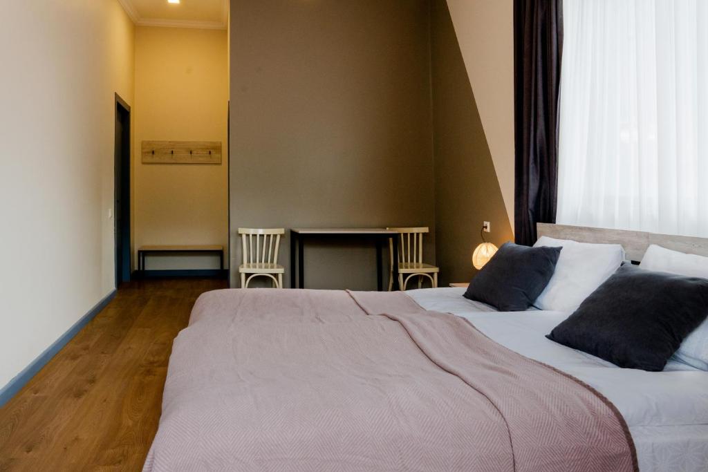 Postel nebo postele na pokoji v ubytování Hotel Jimla