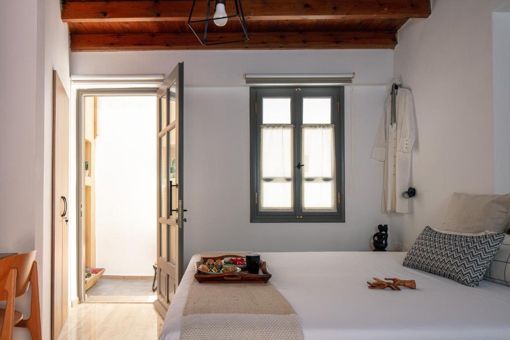 Postel nebo postele na pokoji v ubytování Gateway Suites