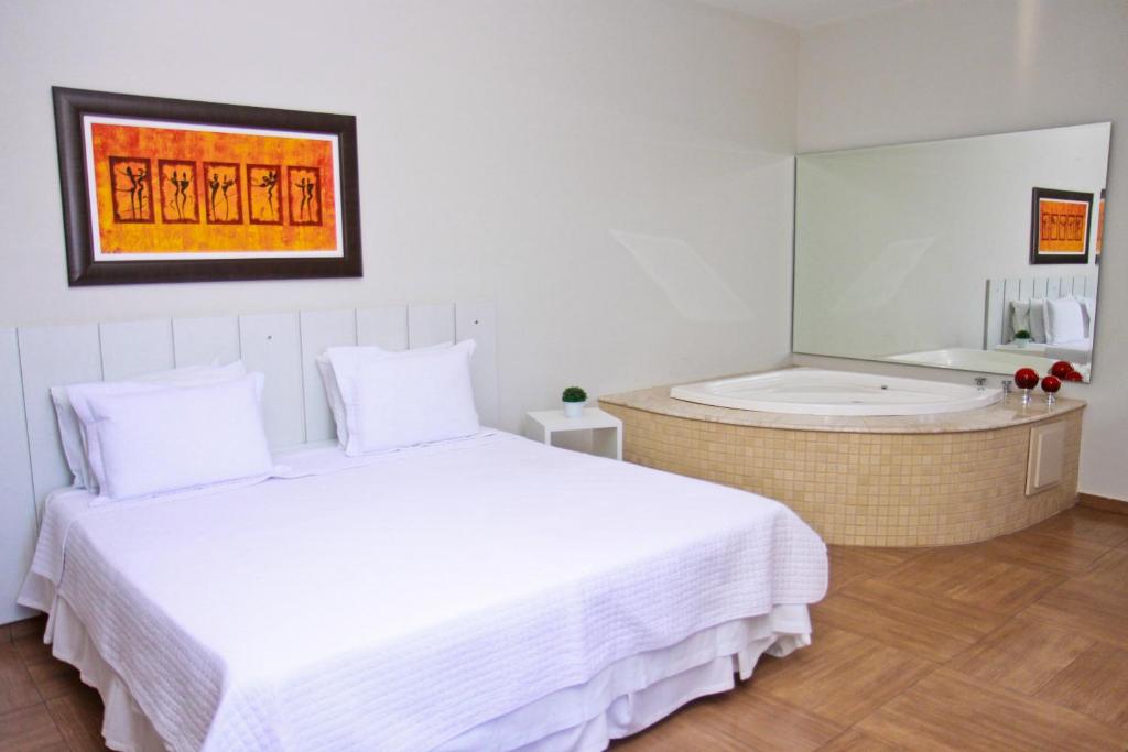 Postel nebo postele na pokoji v ubytování Hotel Portal Premium