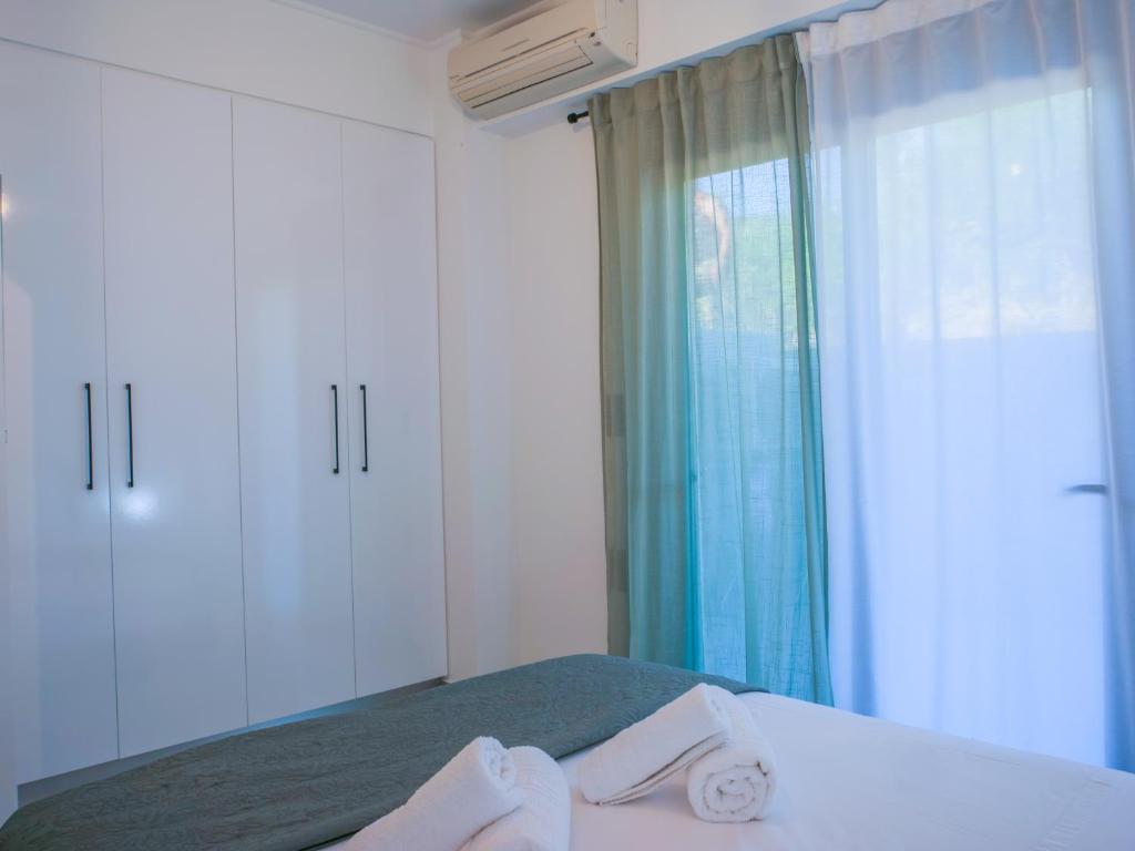 Posteľ alebo postele v izbe v ubytovaní ChriLenia Aparments
