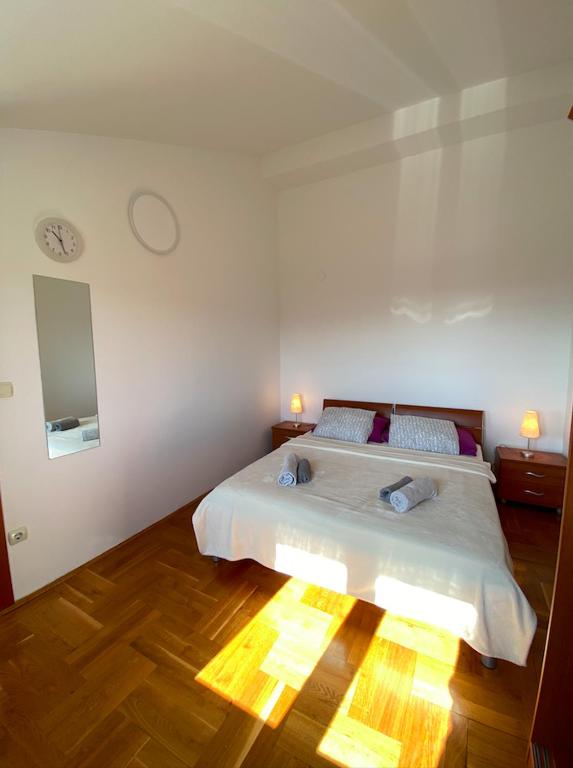 Postel nebo postele na pokoji v ubytování Little summer paradise - apartment with sea view