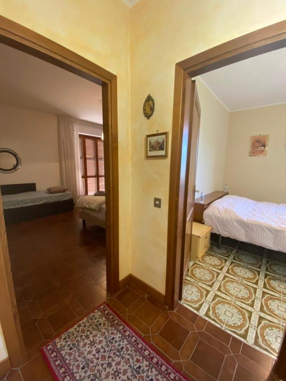 Łóżko lub łóżka w pokoju w obiekcie B&B Rox e Claudia
