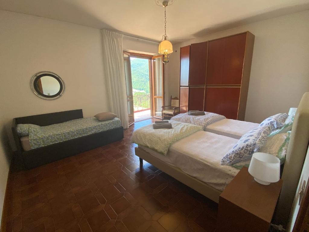 Łóżko lub łóżka w pokoju w obiekcie B&B Rox e Claudia