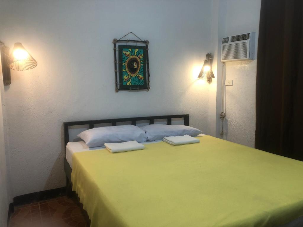 Postel nebo postele na pokoji v ubytování Mylene Room Rental
