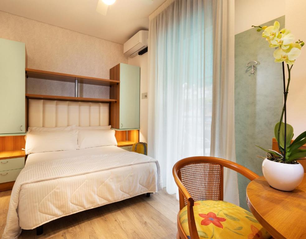 Postel nebo postele na pokoji v ubytování Hotel Castellucci