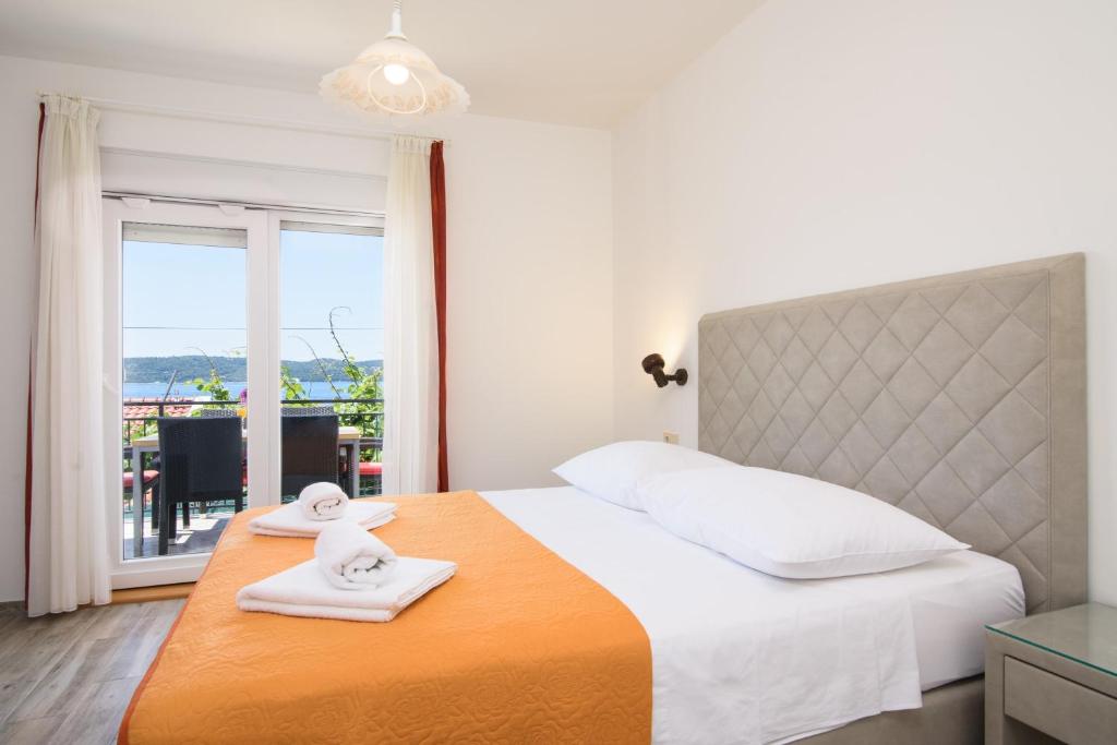 Posteľ alebo postele v izbe v ubytovaní Apartments Mastelic