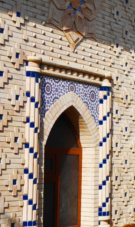 an entrance to a building with a blue and white at Colibri Traditional Guest house in Samarkand