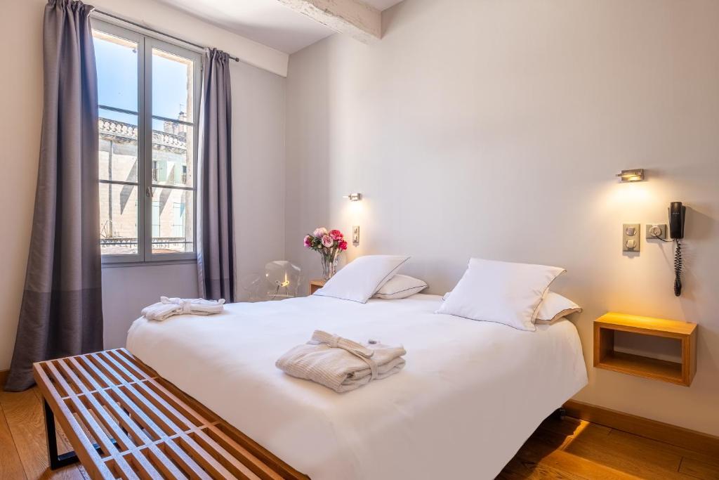 Postel nebo postele na pokoji v ubytování Boutique Hôtel Entraigues