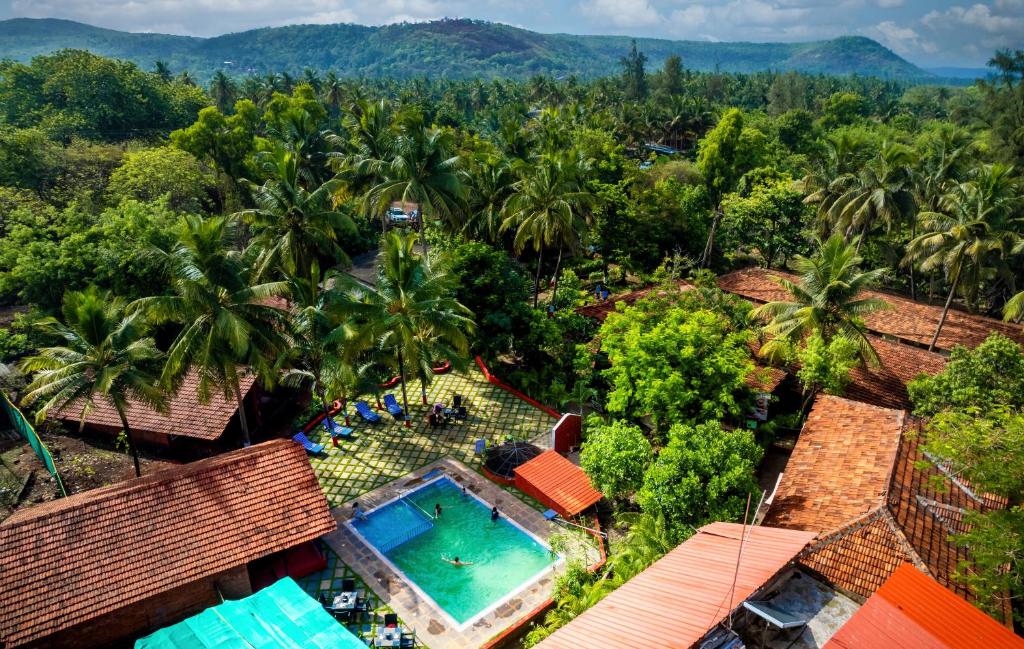 an aerial view of a resort with a swimming pool at Lotus an Eco Beach Resort Dapoli Murud in Dapoli