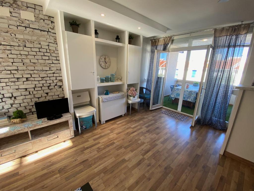TV a/nebo společenská místnost v ubytování Apartamento Mas Pinell B4