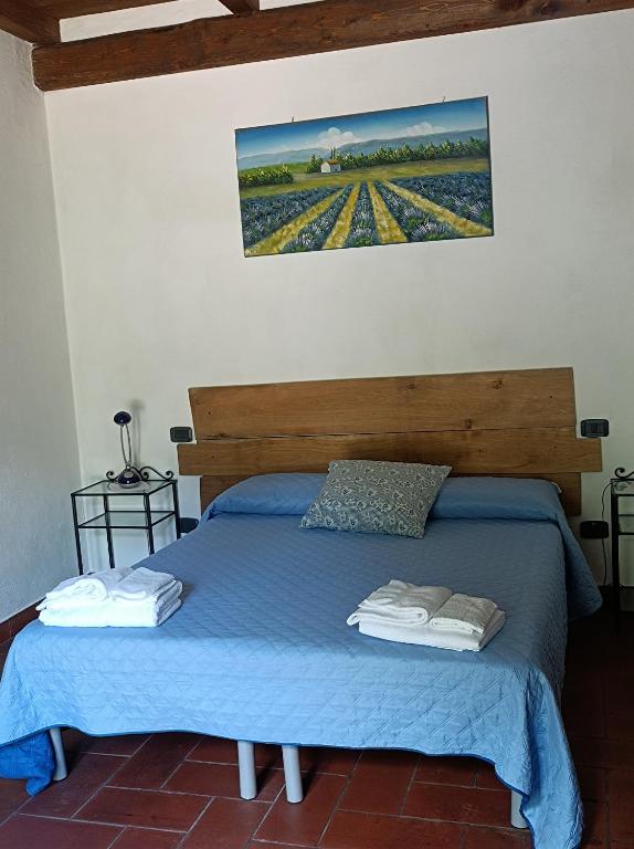 Postel nebo postele na pokoji v ubytování AgriHouse Orvieto