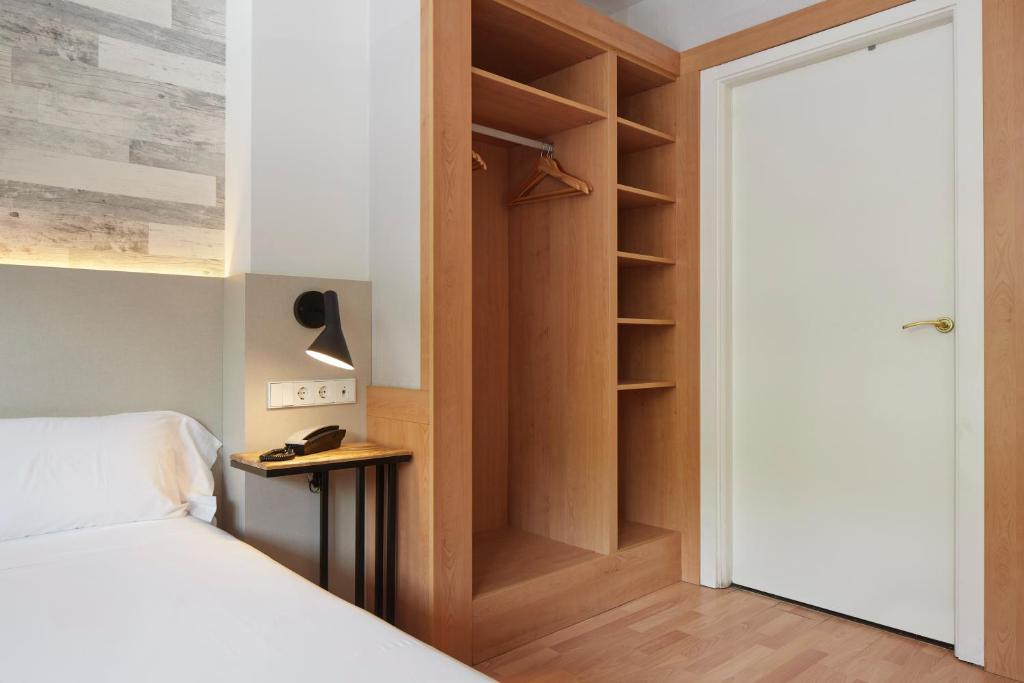 Posteľ alebo postele v izbe v ubytovaní Hotel Berri Versalles