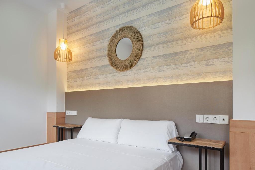 Posteľ alebo postele v izbe v ubytovaní Hotel Berri Versalles
