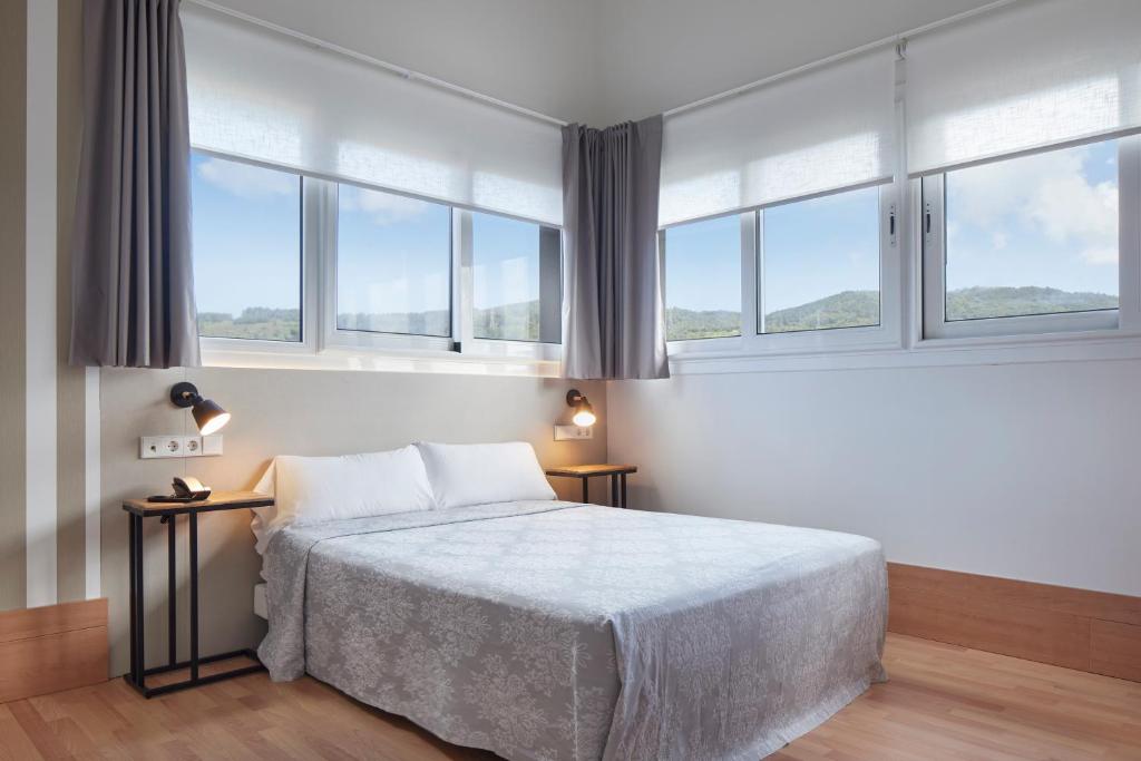 Posteľ alebo postele v izbe v ubytovaní Hotel Berri Versalles