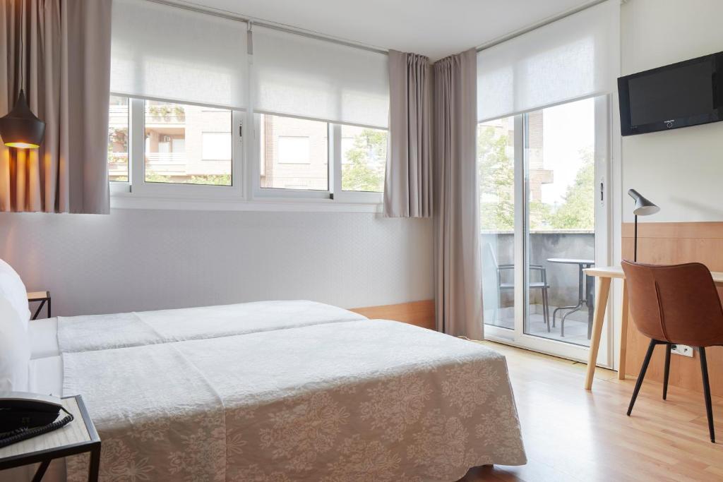 Posteľ alebo postele v izbe v ubytovaní Hotel Berri Versalles