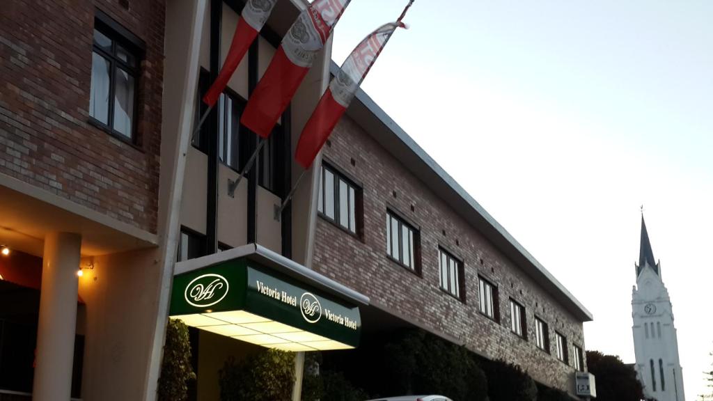 a building with a sign on the side of it at Victoria Hotel in Bredasdorp