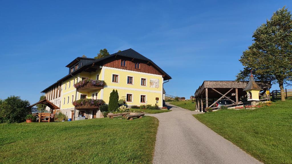 a large house on a hill with a road at Mitterhirschberg, Familie Schweighuber in Waidhofen an der Ybbs