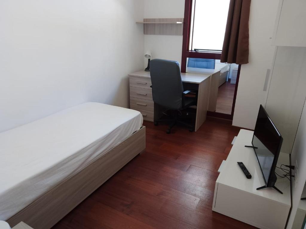 A bed or beds in a room at Ego' Residence Ferrara