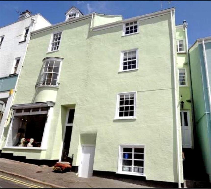 a large white building on the side of a street at Hamilton House in Lyme Regis