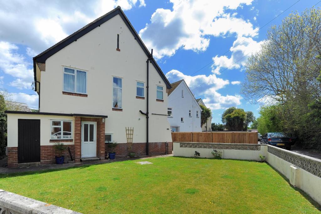 a house with a lawn in front of it at 2 Grange Villas in Charmouth