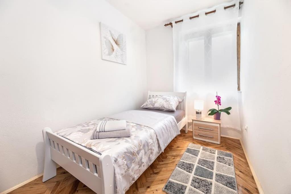 Posteľ alebo postele v izbe v ubytovaní Apartman Aspalathos