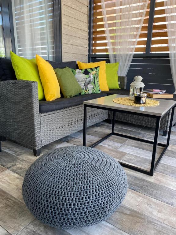 a living room with a couch and a coffee table at La Veranda Sinemorets in Sinemorets