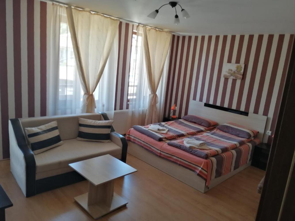 Postel nebo postele na pokoji v ubytování Guest House Tsenovi