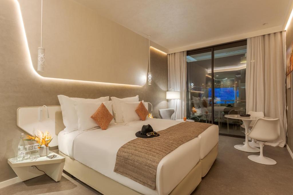 Postel nebo postele na pokoji v ubytování Pestana CR7 Marrakech