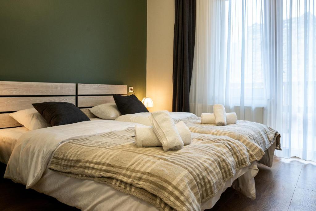 Postel nebo postele na pokoji v ubytování Hotel Jimla
