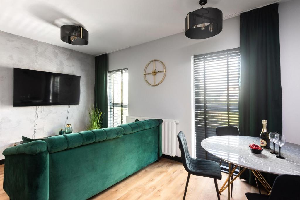 Televízia a/alebo spoločenská miestnosť v ubytovaní Victoria Apartment