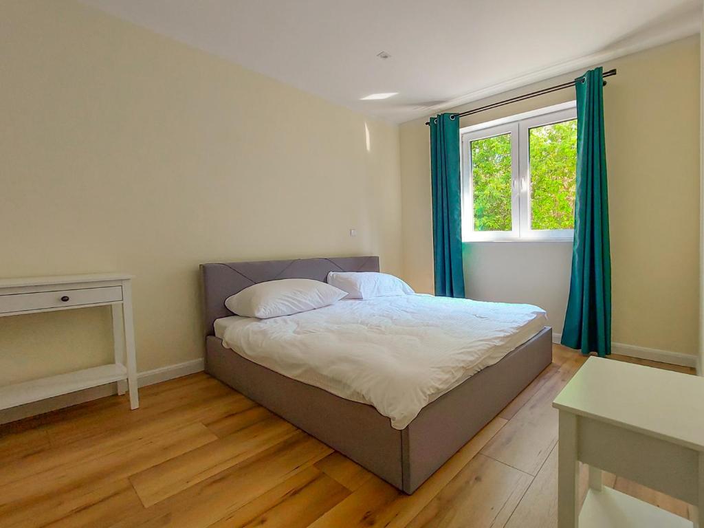 Posteľ alebo postele v izbe v ubytovaní Herta House