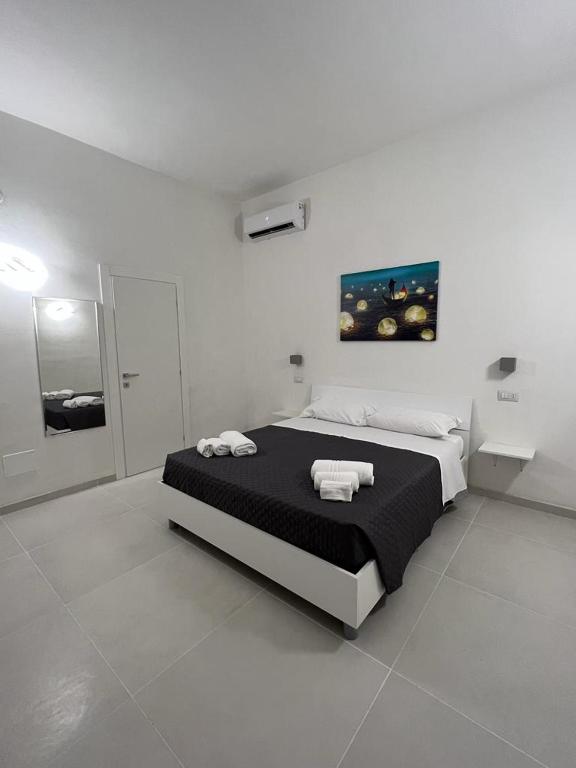 Postel nebo postele na pokoji v ubytování Pirro’s rooms