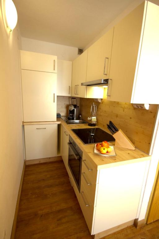 Kuchyň nebo kuchyňský kout v ubytování AlmDorf Tonnerhütte