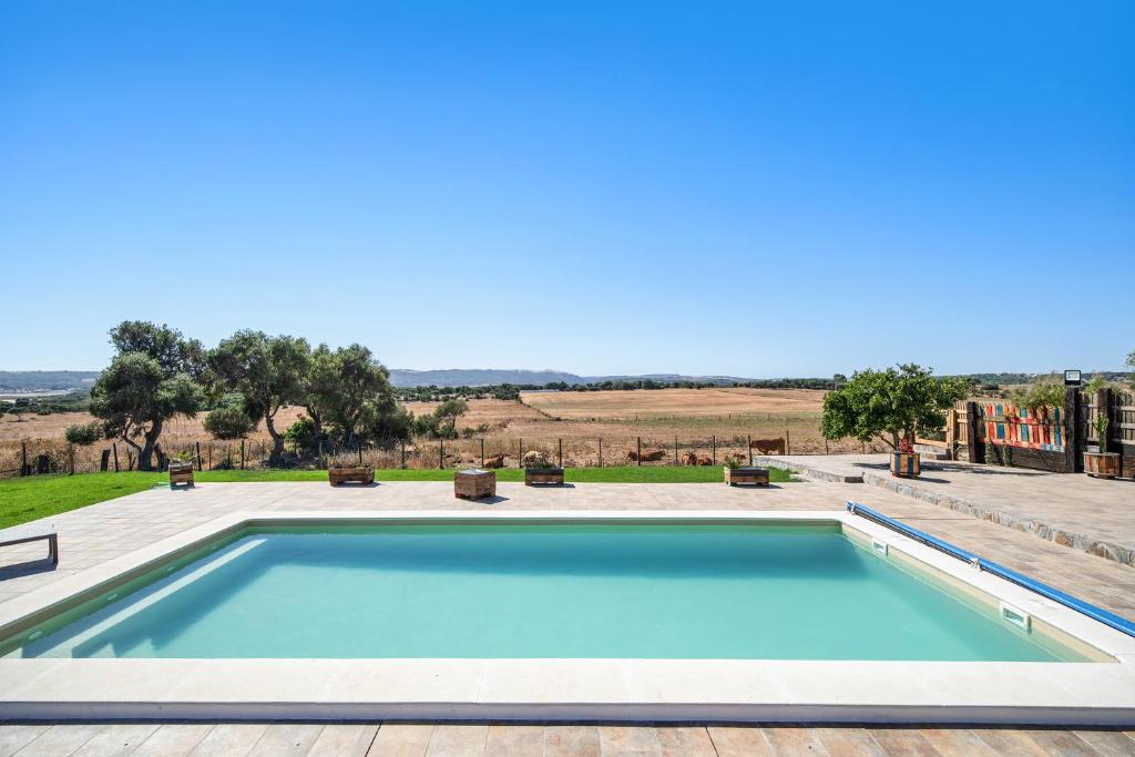 a swimming pool in the middle of a yard at Casa Andrea in Barbate
