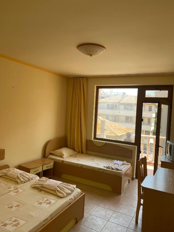 Postel nebo postele na pokoji v ubytování Hotel Apart