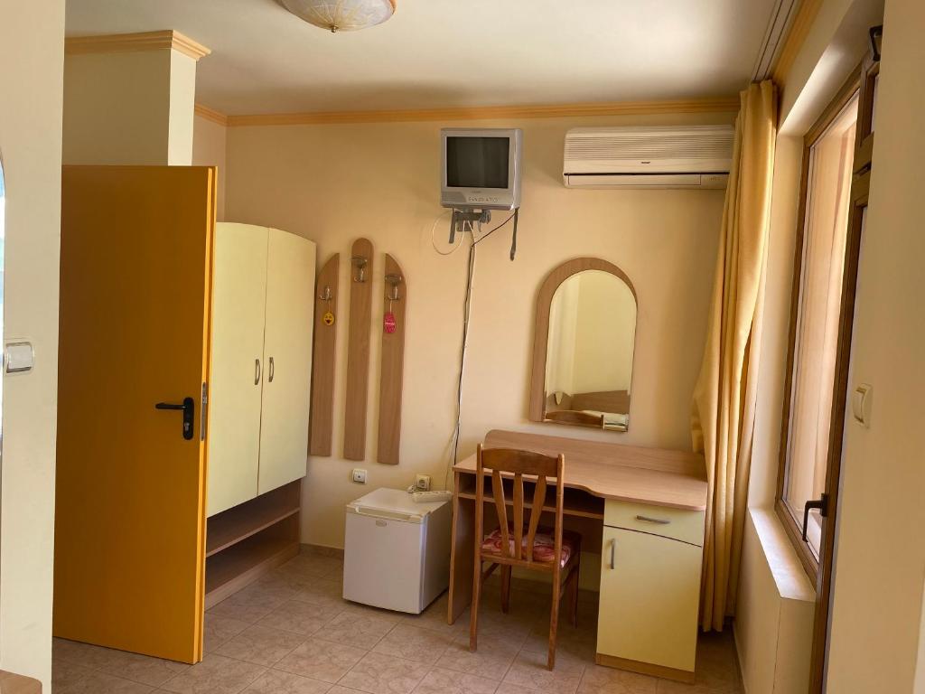 TV a/nebo společenská místnost v ubytování Hotel Apart