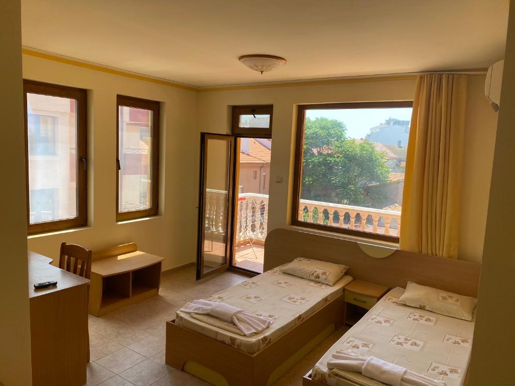 Postel nebo postele na pokoji v ubytování Hotel Apart