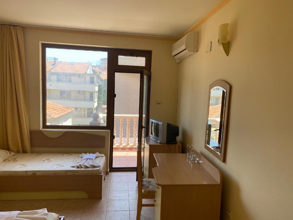 Postel nebo postele na pokoji v ubytování Hotel Apart