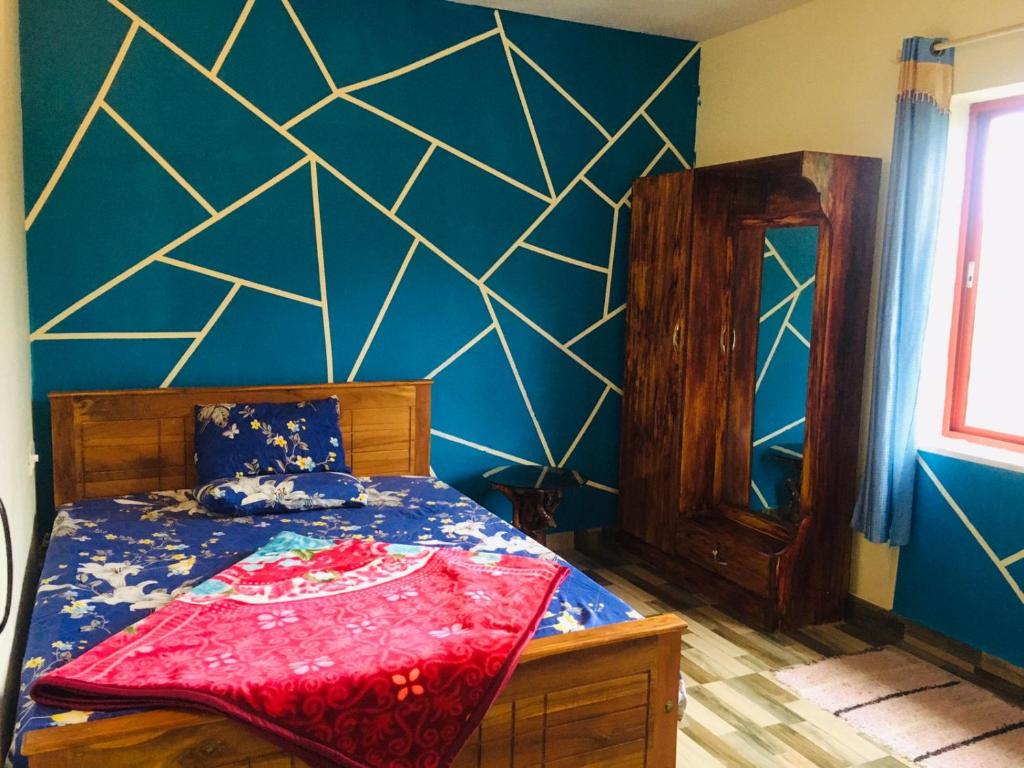 Postel nebo postele na pokoji v ubytování Coorg West End Home Stay