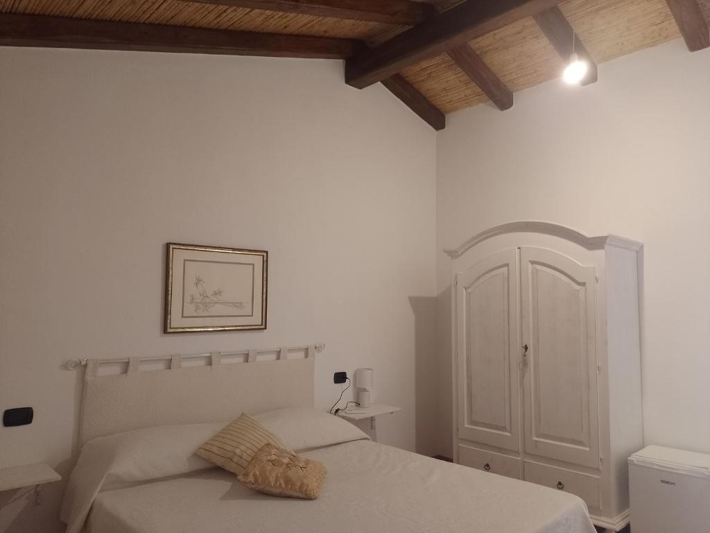 Postel nebo postele na pokoji v ubytování Tenuta Don Ballore