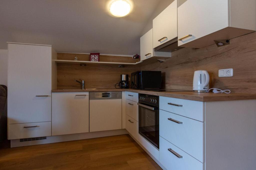 Kuchyň nebo kuchyňský kout v ubytování Gästehaus Alpenstern