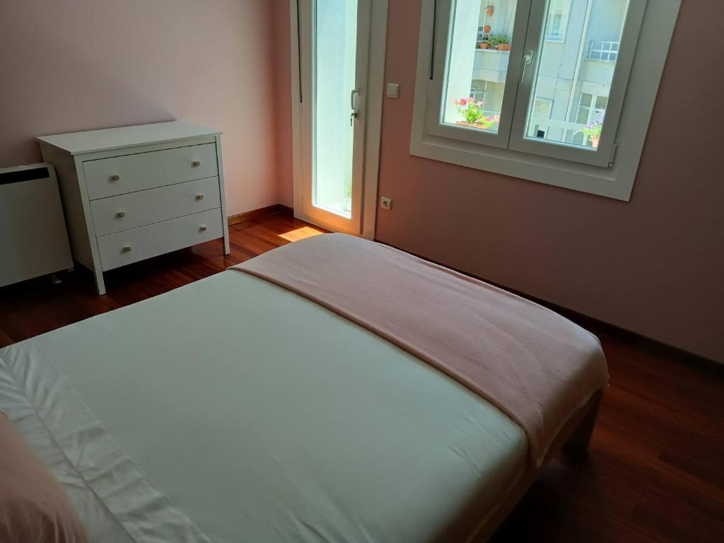 A bed or beds in a room at Rodeira