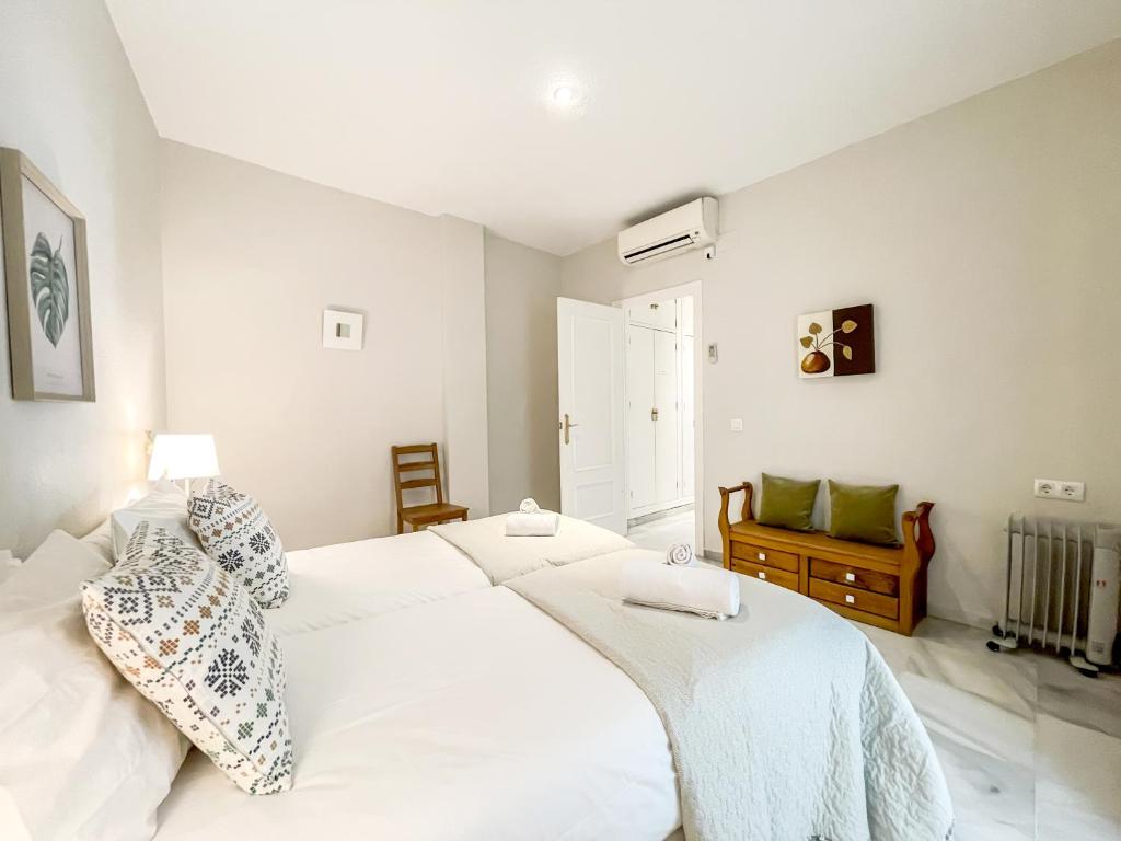 Posteľ alebo postele v izbe v ubytovaní San Marcos Apartamentos
