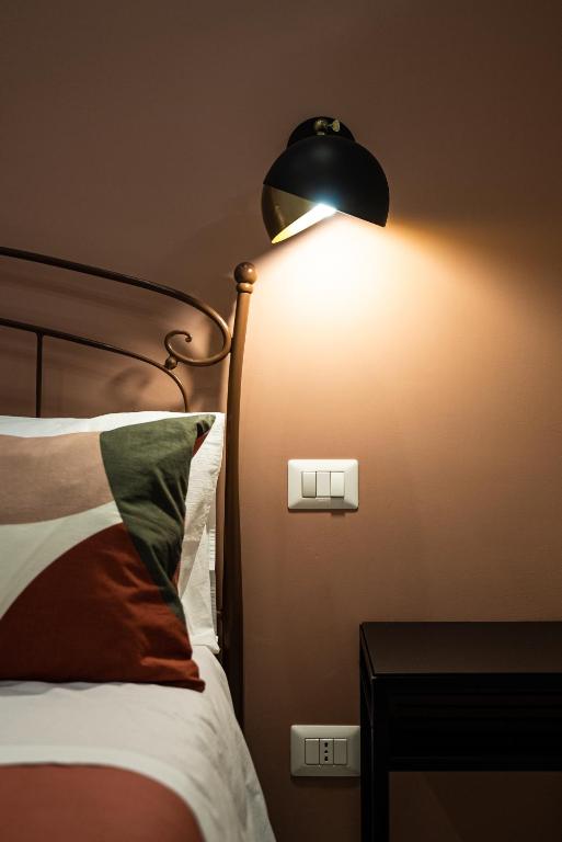 A bed or beds in a room at MATE' APARTMENTS - FREE WIFI & AIR CONDITIONAL - Molfetta, Puglia, Italy